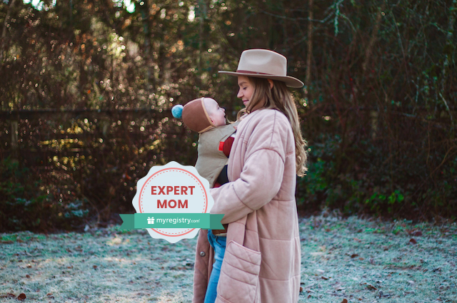 What to Expect from Your Baby’s Sleep Regression, Savannah Walsh holding her youngest child in a frost covered yard.
